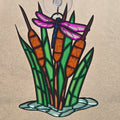 A 3d printed ornament depicting cattails, reeds, and a dragonfly, with a hanging loop at the top, shown against a neutral beige background.